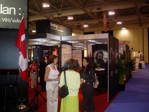 AIDS 2006: Canada Booth- Leading Together: Canada Takes Action on HIV/AIDS - A presentation comprised of a Video Presentation, and 8 ft. Posters as backdrops; photographs of people living with HIV and AIDS from across the country who were interviewed and photographed. XVI International AIDS Conference, August 13 - 18, 2006, Toronto, Canada