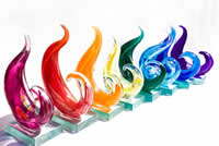 PRIDE Legacy Awards - Eight Award Categories: The eight awards, made of blown glass and shaped in a wave-like design, each represented a colour of the iconic rainbow flag