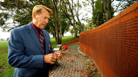 Photo: HIV/AIDS Advocate, Bradford McIntyre, HIV+ since 1984, remembering all the people we have lost to AIDS, at the Vancouver AIDS Memorial. Vancouvber, B.C. Canada. December 1, 2013.