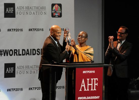 Photo: HOLLYWOOD, CA  NOVEMBER 30, 2016: Harry Belafonte receives the AHF Lifetime Achievement Award for his decades-long humanitarian and charitable works from Cynthia Davis, AHF Board Chair, and Michael Weinstein, AHF President, during AIDS Healthcare Foundations Keep the Promise Concert at the Dolby Theatre in Hollywood, CA on Nov. 30, 2016.