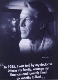 AIDS 2006: Canada Booth - Leading Together: Canada Takes Action on HIV/AIDS, 8ft. Poster Portrait of Bradford McIntyre, living with HIV. Poster caption: In 1985, I was told by my doctor to arrange my finances and funeral; I had six months to live. Exhibition Hall - XVI International AIDS Conference - August 13-18, 2006, Toronto, Canada.