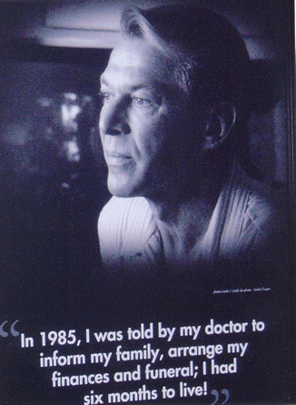 Poster of Bradford McIntyre (8 ft. Poster, at the Government of Canada Booth, Leading Together: Canada Takes Action on HIV/AIDS in the Exhibition Hall at the XVI International AIDS Conference, 2006