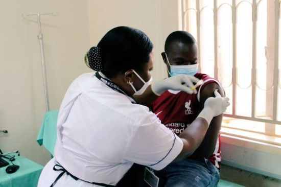 First PrEPVacc volunteer receives his injections and medicines at the launch of the launch of the PrePVacc Trial at the Masaka site