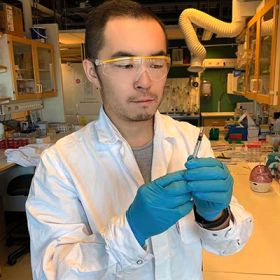 man examining test tube in laboratory