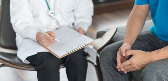 a man speaking to a doctor