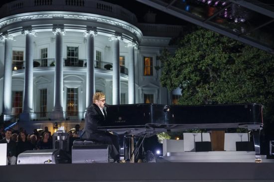Sir Elton delighting the audience by playing several of his smash hits on the White House South Lawn