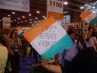 Photo: AIDS 2006: Treatment activists carry flags that read: LIVES BEFORE PROFIT. AIDS 2006: Treatment activists carry flags that read: LIVES BEFORE PROFIT.
