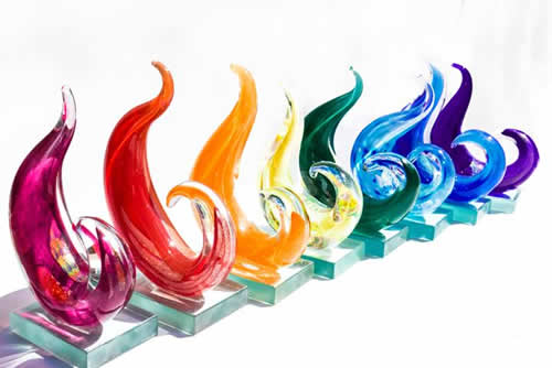 PRIDE Legacy Awards - Eight Award Categories - The eight awards, made of blown glass and shaped in a wave-like design, each represented a colour of the iconic rainbow flag