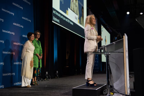 Photo: Professor Sharon Lewin delivers her acceptance speech after being announced IAS President at AIDS 2022. Outgoing President Professor Adeeba Kamarulzaman and IAS Executive Officer Dr Birgit Poniatowski look on. Image: İMarcus Rose/IAS Professor Sharon Lewin. IAS President