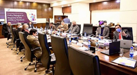 Zubair Faisal Abbasi (right) addresses a meeting on policy dialogue in response to COVID19.
Photo credit: Saadeqa Khan