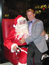Bradford McIntyre, BCPWA Member, sitting on Santa Claus's lap - BCPWA Member's Holiday Season Dinner - December 9, 2010