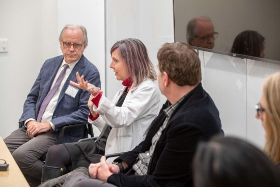 Shannon Galvin, MD, associate professor of Medicine in the Division of Infectious Diseases, shares her insights during the opening panel discussion about the state of global AIDS management and recent developments in treating the disease. (Photo: Randy Belice)