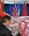 Mayor Gregor Robertson signing the We Care RED RIBBON Campaign Poster - Vancouver City Hall - November 1, 2010 - Photo Credit: Bradford McIntyre