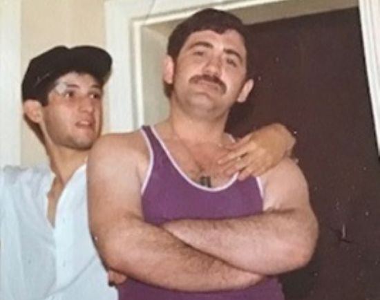 Terry Higgins in purple vest, arms folded. Photo supplied by Linda Payan.