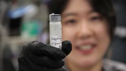Postdoctoral fellow Xuefei Chen holds a vial of butyrolactol A, which she discovered can work in tandem with other medicine to attack otherwise drug-resistant fungi.