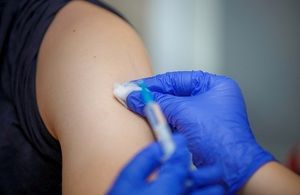 arm vaccine syringe close up