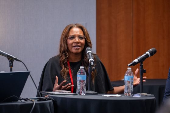 Photo: Athena Cross, Dr.PH., speaks at HJ26 during the panel "Why can't we end the HIV epidemic in the US?" Photo by Zachary Linhares Athena Cross, Dr.PH.