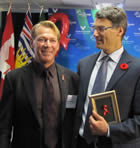 Photo: Bradford McIntyre, Board of Directors, AIDS Vancouver and Mayor Gregor Robertson - We Care RED RIBBON Campaign Launch - Vancouver City Hall - November 1, 2010.