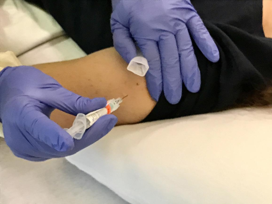 Image of a person getting a shot. NIAID Image of a person getting a shot