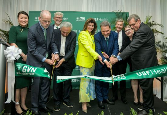 Leaders of USF and the Global Virus Network cutting the ceremonial ribbon for the new international headquarters