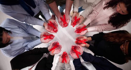 In a circle holding ribbons. iStockPhoto | AndreyPopov Credit