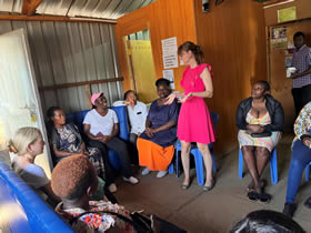 Dr. Julie Lajoie speaking with female sex workers, researchers, and staff at the Majengo Clinic in Nairobi.