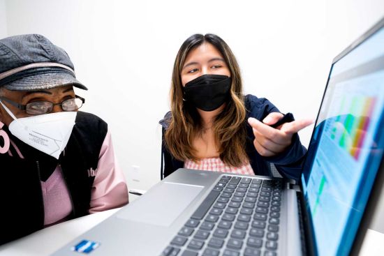 UCSF Clinical Research Coordinator Kathleen Bellon Pizarro (right) speaks with long COVID patient Hulda Brown (left) while working on UCSF�s Long-term Impact of Infection with Novel Coronavirus (LIINC) project. Photo by Noah Berger