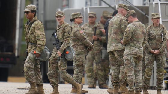Military personnel in uniform, with the Texas National Guard patch on, are seen at the U.S. Army Reserve Center, Tuesday, Oct. 7, 2025, in Elwood, Ill., a suburb of Chicago. (AP Photo/Erin Hooley)