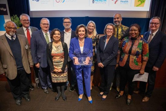 House Speaker Emeritra Nancy Pelosi takes a photo with students from UCSFs Global Health Sciences department. Photo by Erin Lubin