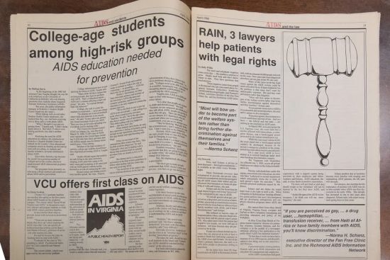 A photo of an old newspaper with stories about AIDS