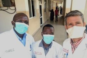 Dr. Robert Peck (right) and colleagues enrolling participants at one of the 20 Tanzanian public hospitals where the Daraja trial was conducted.